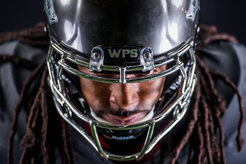 Why Running Back Alex Collins Wears a Super Dark Facemask Visor