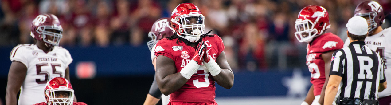 Arkansas defensive lineman McTelvin Agim gets ready to run a play against  Mississippi State during an NCAA college football game, Saturday, Nov. 2,  2019 in Fayetteville, Ark. (AP Photo/Michael Woods Stock Photo 