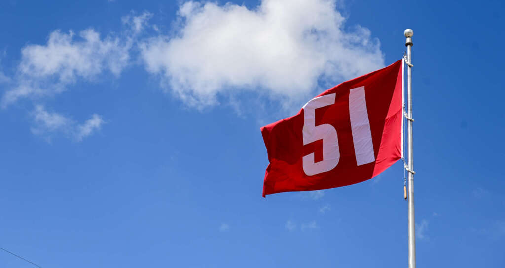 Flag raising ceremony kicks off home meet weekend